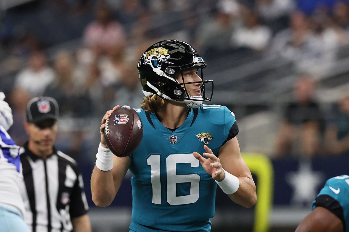 Jacksonville Jaguars quarterback Trevor Lawrence (16) throws in the pocket for a touchdown in the first quarter against the Dallas Cowboys at ATandT Stadium.