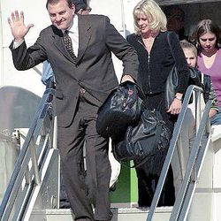 Iowa State coach Dan McCarney walks down the steps after stepping off a plane at Sky Harbor Airport on Friday, Dec. 22, 2000, in Phoenix. McCarney is followed by his wife Margy, and daughters Melanie, 11, and Jillian, 13. Iowa State will face Pittsburgh in the Insight.com Bowl on Thursday.