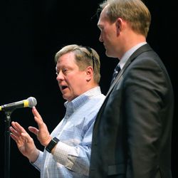 Draper Mayor Troy Walker and Salt Lake County Mayor Ben McAdams tray to speak to angry Draper residents at a meeting at Draper Park Middle School on Wednesday, March 29, 2017.