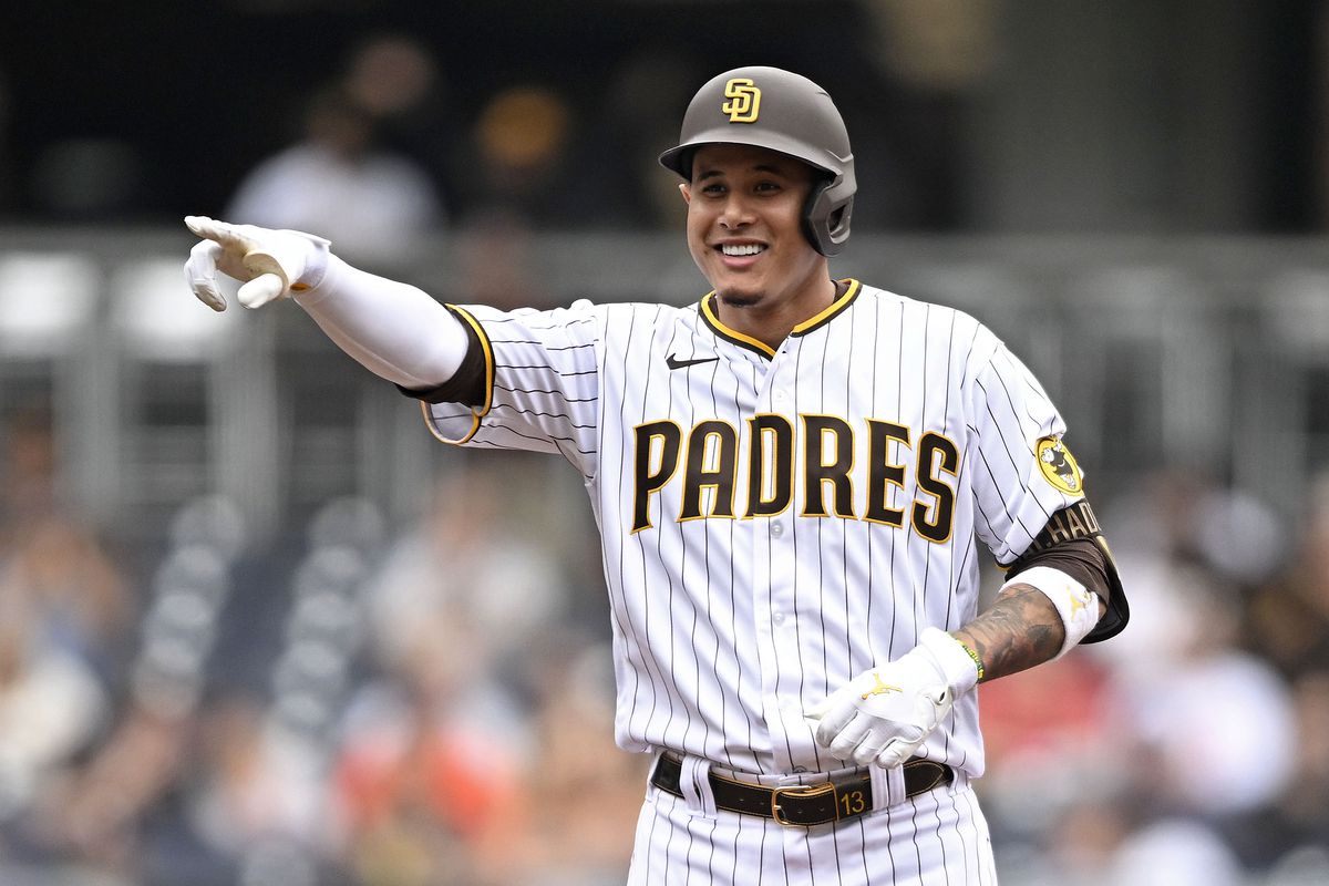 Manny Machado of the San Diego Padres points back to the dugout after hitting a double during the first inning of a baseball game against the San Francisco Giants on October 5, 2022 at Petco Park in San Diego, California.