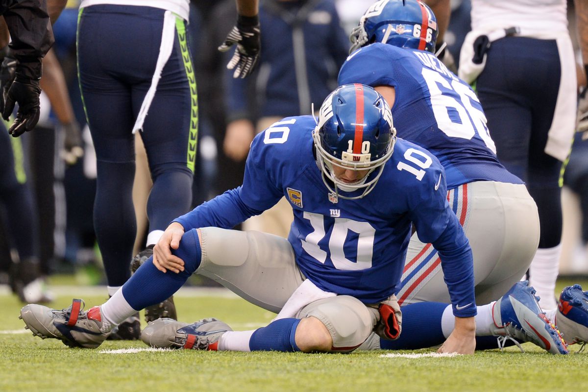 Eli Manning spent too much time picking himself up off the ground in 2013