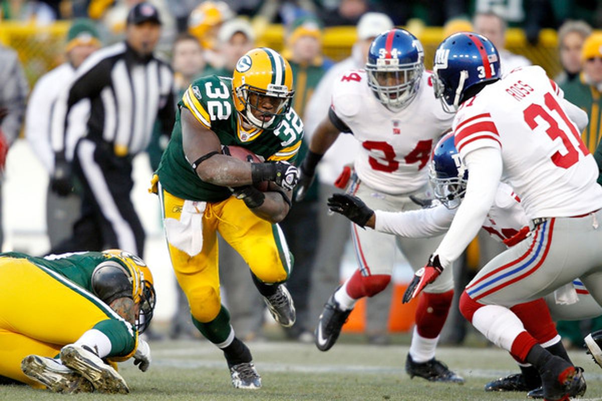 GREEN BAY WI - DECEMBER 26: Brandon Jackson #32 of the Green Bay Packers carries the ball against the New York Giants at Lambeau Field on December 26 2010 in Green Bay Wisconsin.  (Photo by Matthew Stockman/Getty Images)