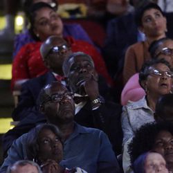 Spectators listen as sportscaster Bryant Gumbel delivers a eulogy during Muhammad Ali's memorial service, Friday, June 10, 2016, in Louisville, Ky. 