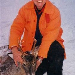 In this 2012 photo taken by Viola Hanson, George Krog poses with a buck he killed in Two Harbors, Minn. After a heart attack two years ago, Krog scaled back his hunting.