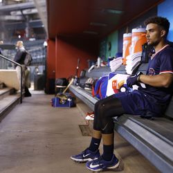 Harry Ford #1 of Team Great Britain sits in the dugout during a workout in advance of the World Baseball Classic at Chase Field