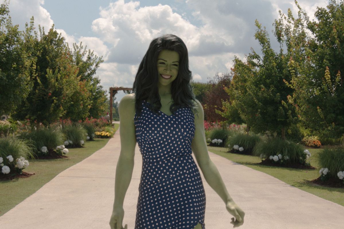 She-Hulk walks down a dirt path in a blue dress with white polka dots