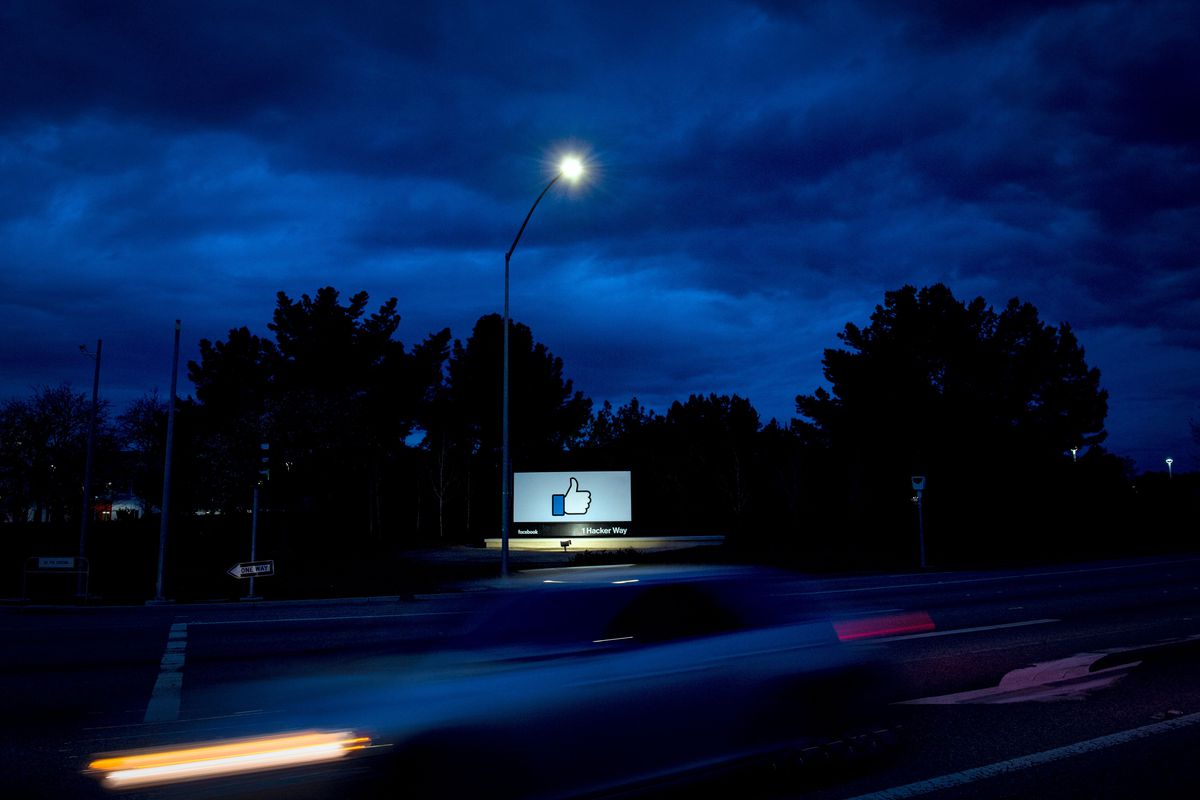 A car passes by Facebook’s corporate headquarters in Menlo Park, California, on March 21, 2018.
