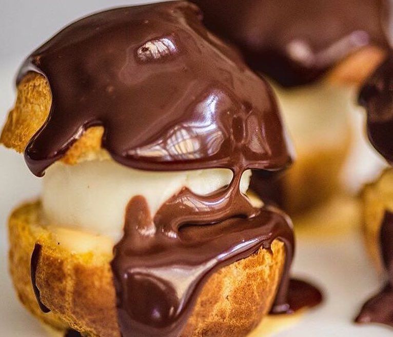 Profiteroles with choux pastry, chocolate and custard at Quo Vadis in Soho, one of the best places to eat Pastry in London
