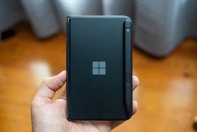 A black Surface Duo 2 with the Surface Pen bumper cover attached.