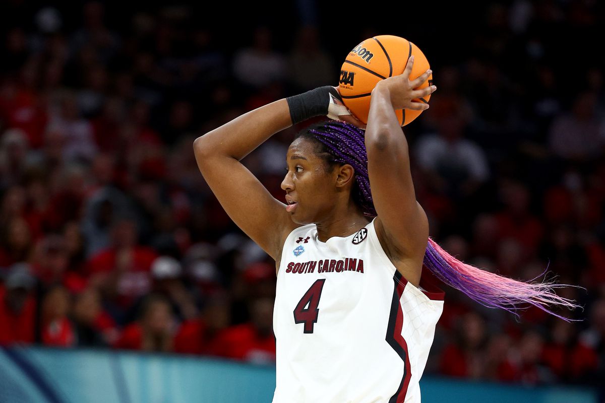 Aliyah Boston #4 of the South Carolina Gamecocks looks to pass the ball in the third quarter against the Louisville Cardinals during the 2022 NCAA Women’s Final Four semifinal game at Target Center on April 01, 2022 in Minneapolis, Minnesota.