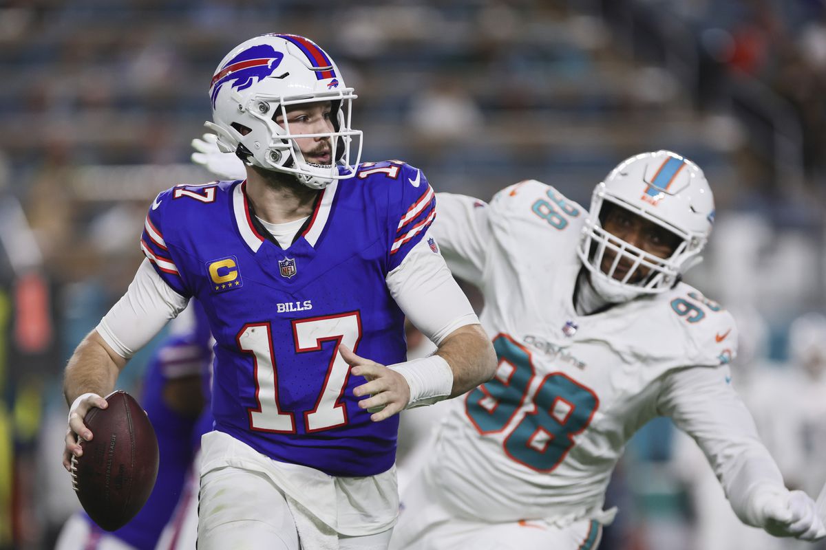 Buffalo Bills quarterback Josh Allen runs with the football against the Miami Dolphins during the second quarter at Hard Rock Stadium.