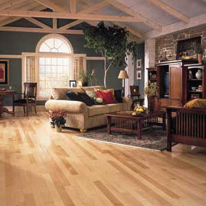 <p>Solid-wood Strip flooring, popular in new construction, can be refinished many times. This solid-maple Kennedale Prestige Plank from Bruce Hardwood Floors contrasts nicely with the dark-stained wood furniture and painted walls.</p>
