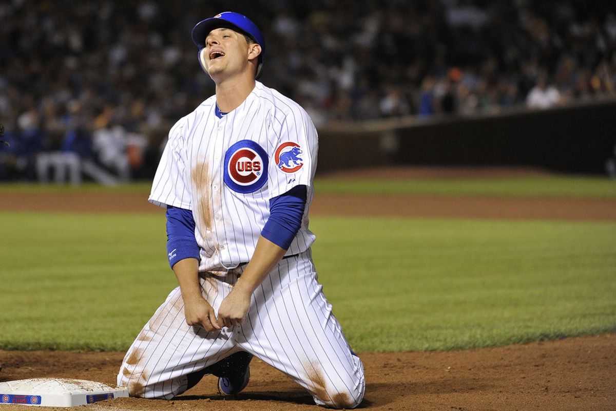 Bryan LaHair of the Chicago Cubs reacts after he was picked off of first base against the New York Mets at Wrigley Field in Chicago, Illinois.  (Photo by Brian Kersey/Getty Images)