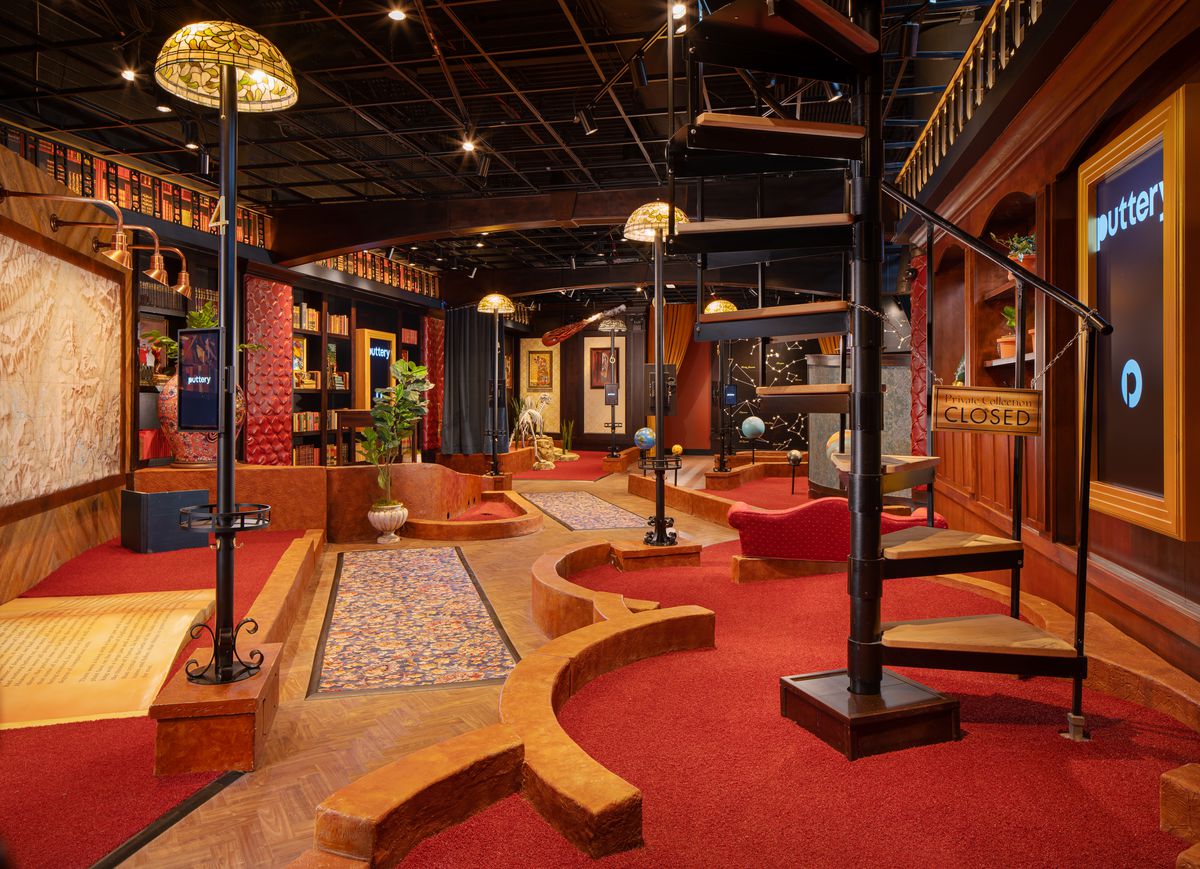 A miniature golf course made to look like an old library.