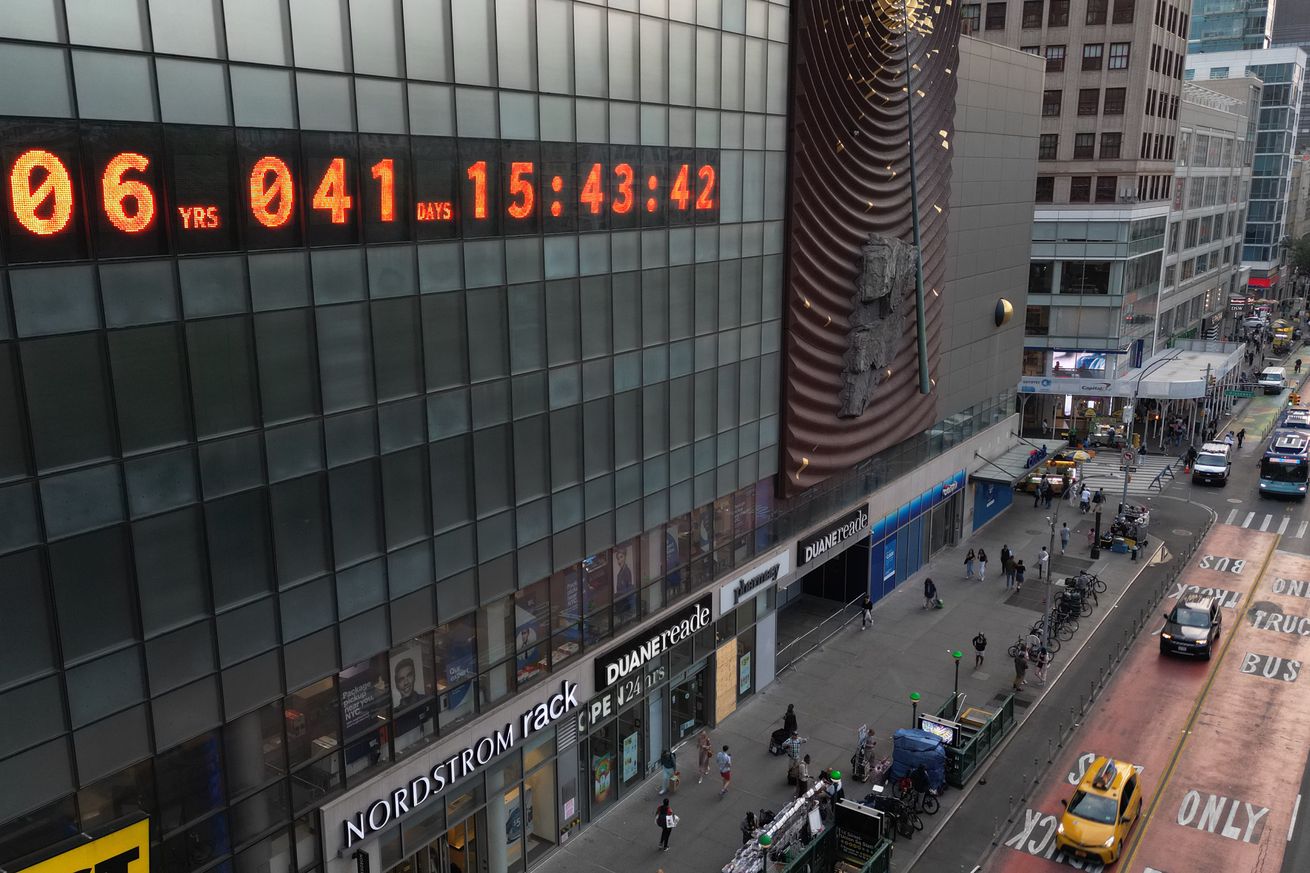A digital clock displayed on a building facade reads: 06 years and 041 days.