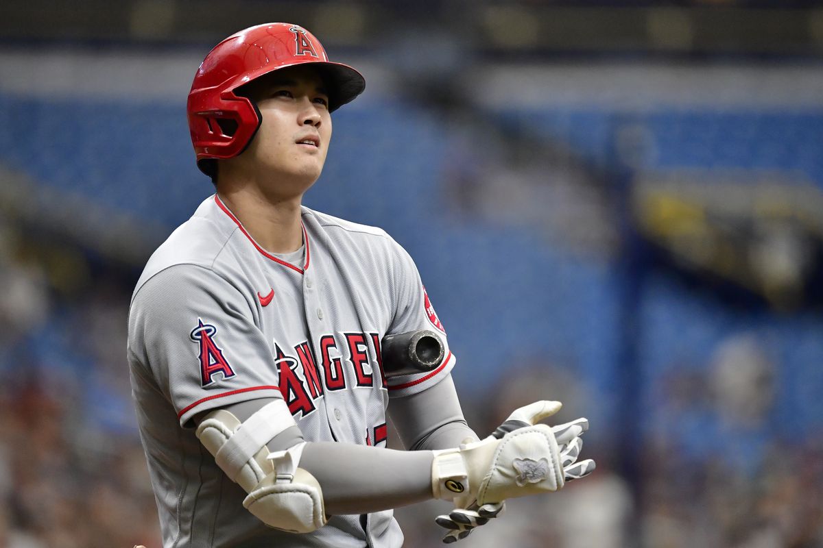 Shohei Ohtani of the Los Angeles Angels looks on during the first inning against the Tampa Bay Rays at Tropicana Field on June 27, 2021 in St Petersburg, Florida.
