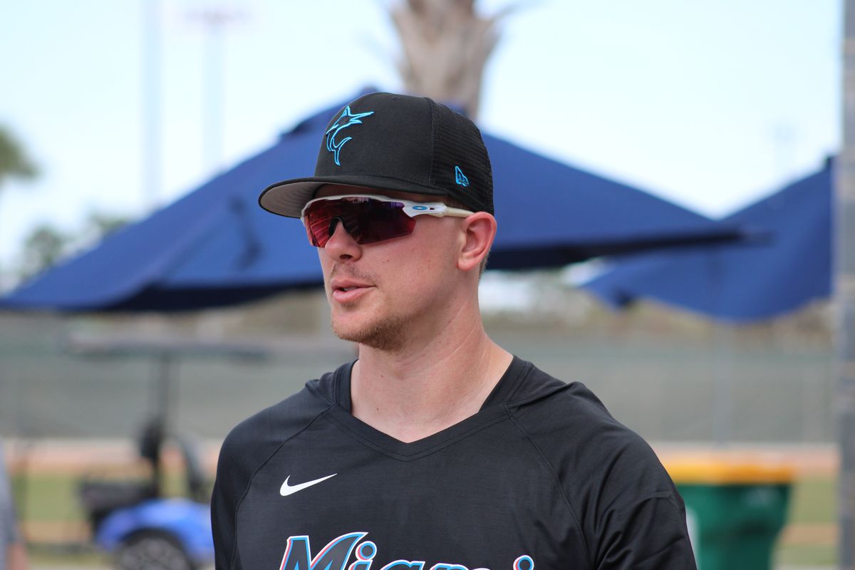Marlins prospect Troy Johnston wearing sunglasses and black warmups at 2023 Spring Training