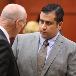 George Zimmerman, right, talks to co-counsel Don West,  during questioning of potential jurors in Seminole circuit court on the eighth day of his trial, in Sanford, Fla., Wednesday, June 19, 2013.  Zimmerman has been charged with second-degree murder for the 2012 shooting death of Trayvon Martin. 