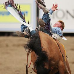 JR Vezain rides bareback during the Days of '47 Rodeo in Salt Lake City on Thursday, July 20, 2017.