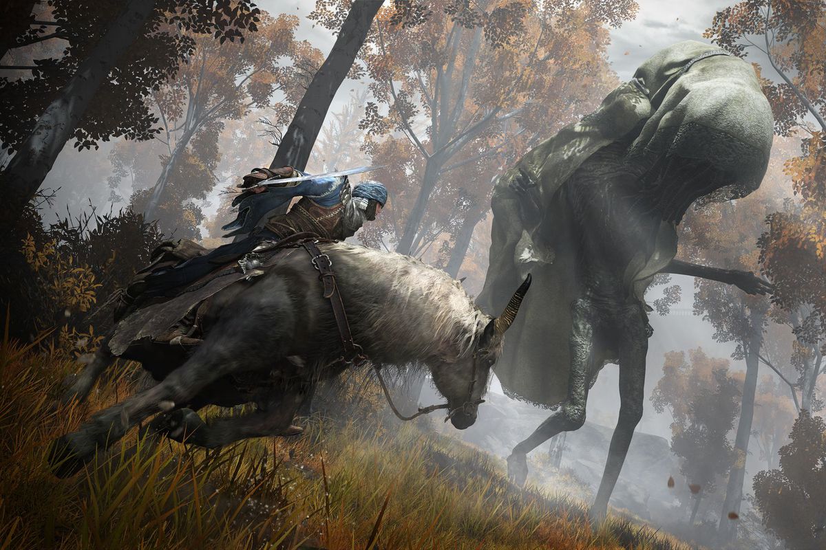 A warrior on horseback encounters a giant in a golden forest in a screenshot from Elden Ring