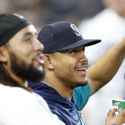 J.P. Crawford #3 and Julio Rodriguez #44 of the Seattle Mariners look on during the eighth inning against the Texas Rangers