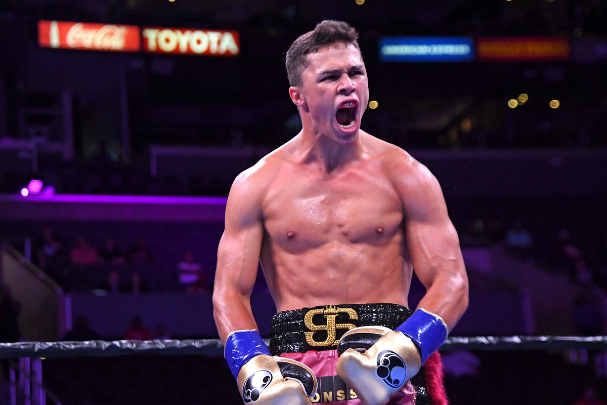 Joey Spencer (red trunks) reacts after he defeated Travis Gambardella (not in frame) with a third round TKO during in Super Welterweight fight at Staples Center on September 28, 2019 in Los Angeles, California.