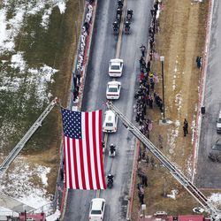 The procession begins following funeral services for Utah County Sheriff's Sgt. Cory Wride Wednesday, Feb. 5, 2014, at Utah Valley University in Orem.