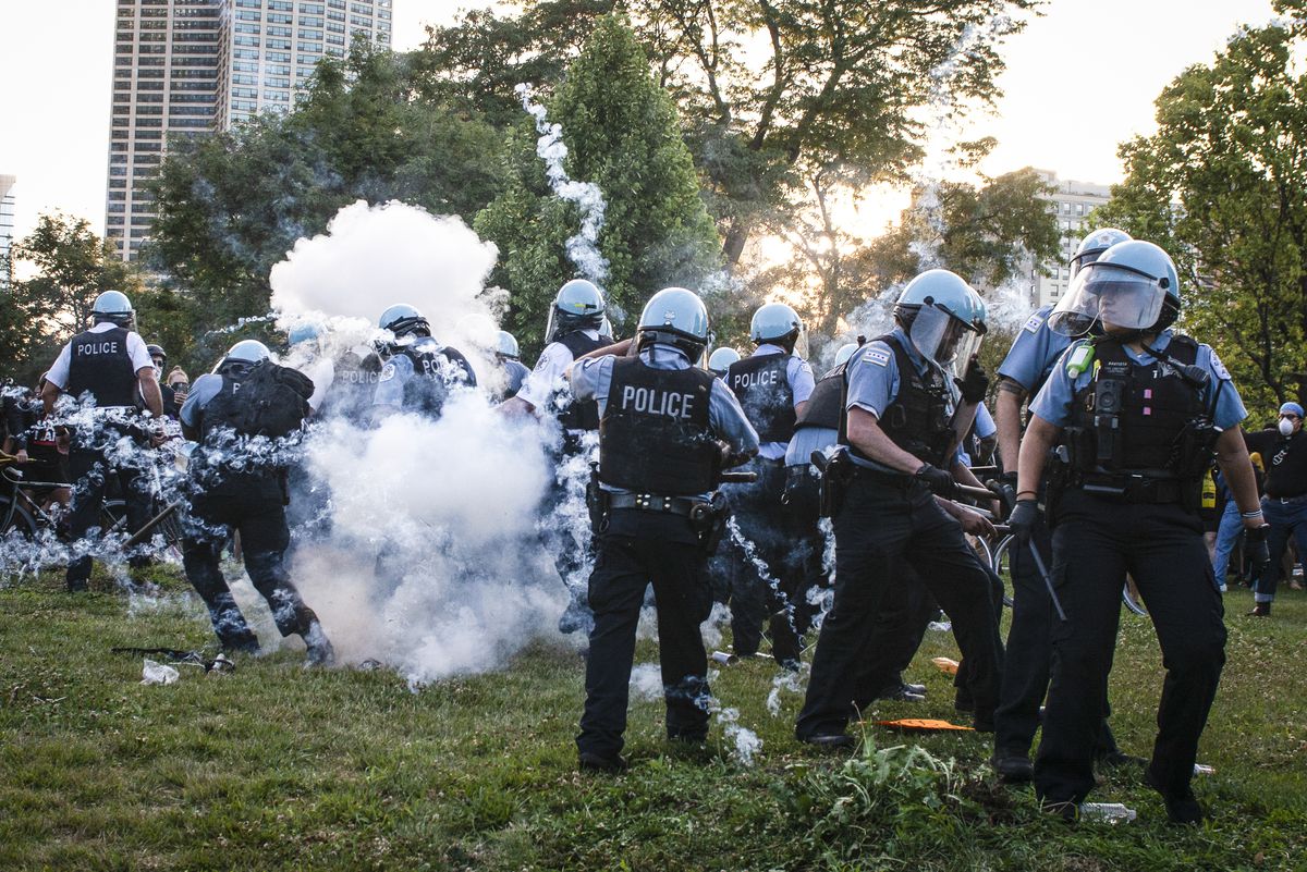 Hundreds of protesters surrounded the Christopher Columbus statue in Grant Park on Friday. They attempted to pull the statue down and many battled with Chicago Police.