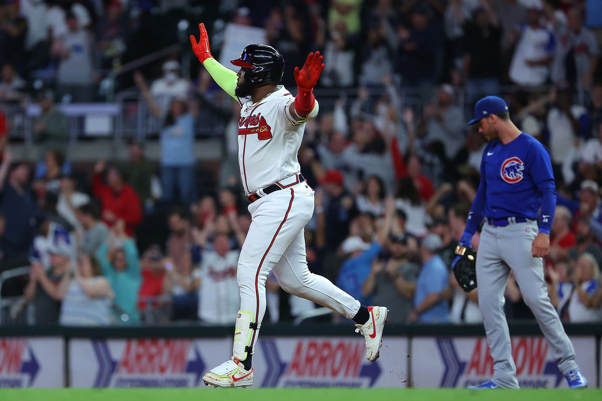 Marcell Ozuna of the Atlanta Braves reacts as he rounds first base after hitting a solo homer in the ninth inning against the Chicago Cubs at Truist Park on September 27, 2023 in Atlanta, Georgia.