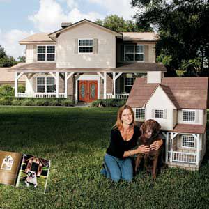 <p><strong>1st Place Winner</strong> <br>Morgan in front of the Lutz, Florida, home that she re-created in canine scale for her chocolate Labrador, Sadie.</p>