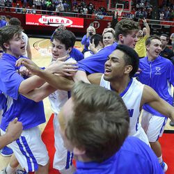 Bingham players celebrate their 61-44 win over Copper Hills in the 5A basketball championship in the Huntsman Center at the University of Utah Saturday, March 5, 2016. 