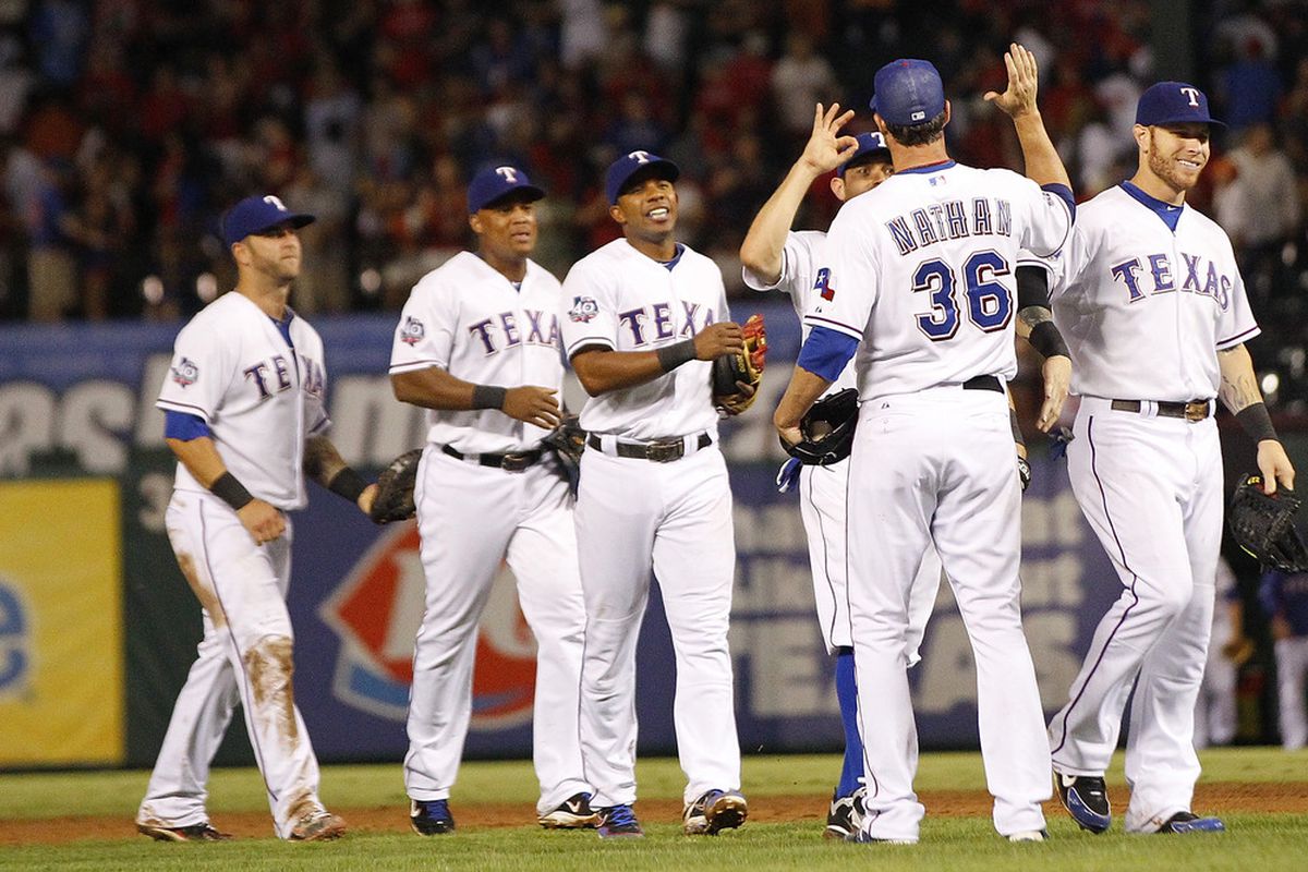 ARLINGTON, TX - JUNE 13: Joe Nathan #36 of the Texas Rangers is congratulated by his teammates for the win against the Arizona Diamondbacks at Rangers Ballpark in Arlington on June 13, 2012 in Arlington, Texas. (Photo by Rick Yeatts/Getty Images)