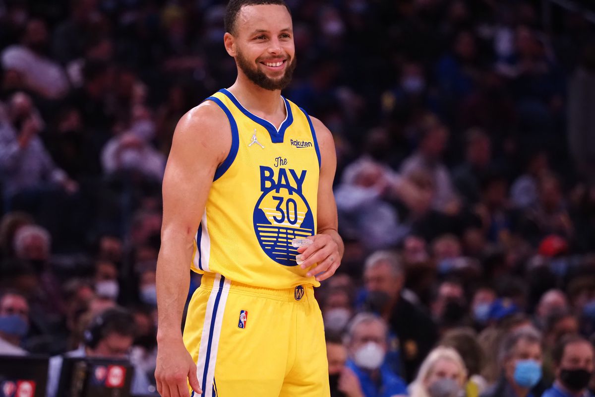  San Francisco, California, USA; Golden State Warriors guard Stephen Curry (30) smiles between plays against the Minnesota Timberwolves