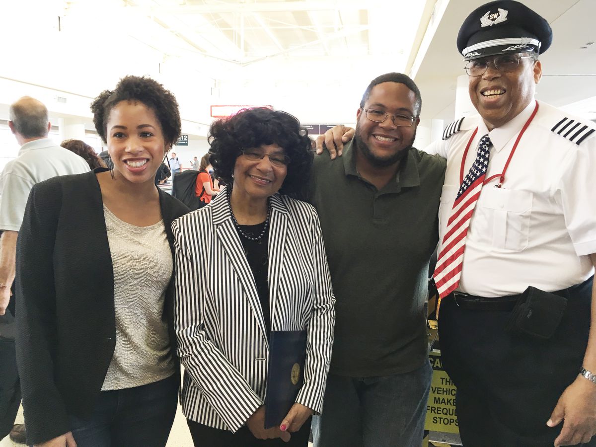 Southwest Airlines Chief Capt. Louis Freeman with his family, after flying his last flight in to Midway before retiring. His daughter Nikki (left), wife Stephanie Woodfork, and son Steven joined him. | Maudlyne Ihejirika/Sun-Times