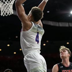 Arizona’s Chase Jeter (4) flies in from the baseline for a two-handed slam during the Arizona-Utah game in McKale Center on January 5 in Tucson, Ariz.