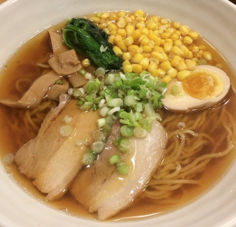 Bowl of ramen with charashi, noodles and corn