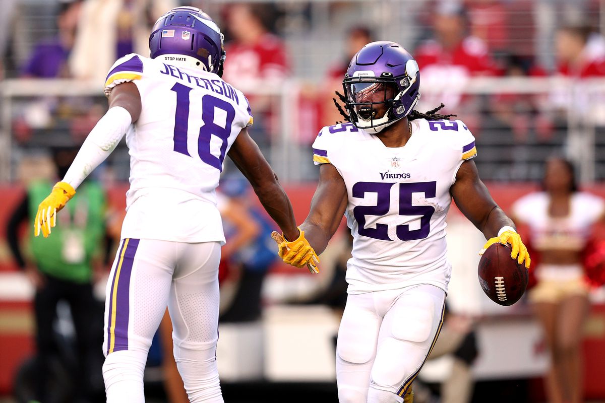 Alexander Mattison #25 of the Minnesota Vikings celebrates with Justin Jefferson #18 after scoring on a rushing touchdown against the San Francisco 49ers in the third quarter at Levi’s Stadium on November 28, 2021 in Santa Clara, California.