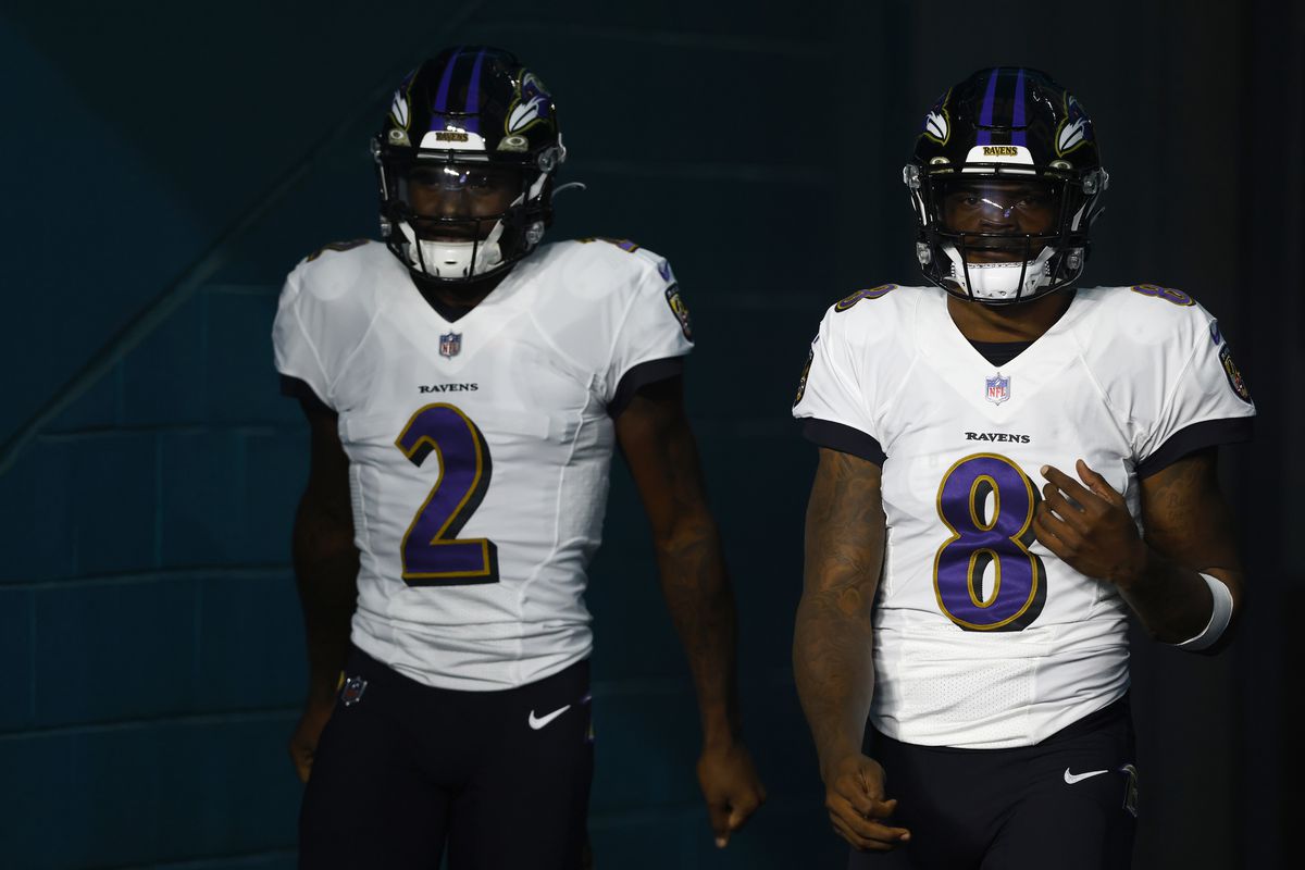 Tyler Huntley #2 and Lamar Jackson #8 of the Baltimore Ravens prepare to take the field prior to the game against the Miami Dolphins at Hard Rock Stadium on November 11, 2021 in Miami Gardens, Florida.