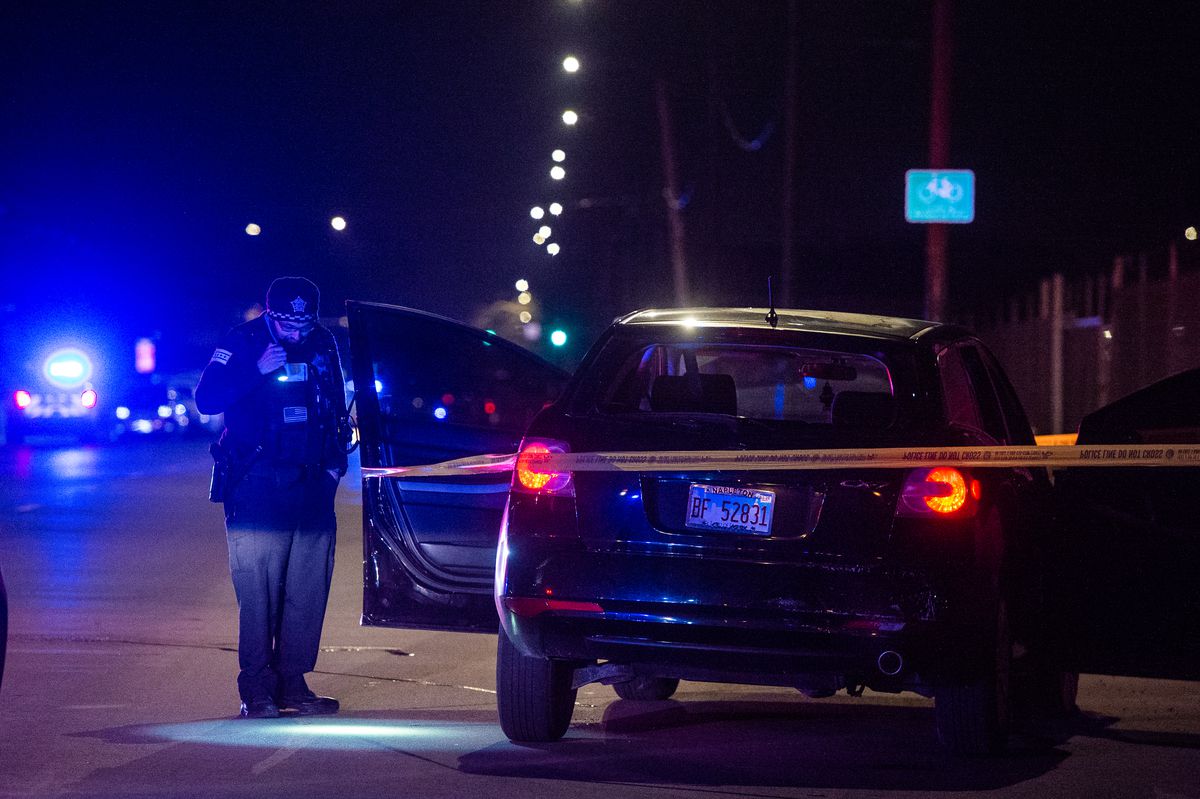 Chicago Police investigate the scene where two people where shot, Saturday night, in the 5000 block of South California, in the Gage Park neighborhood. | Tyler LaRiviere/Sun-Times
