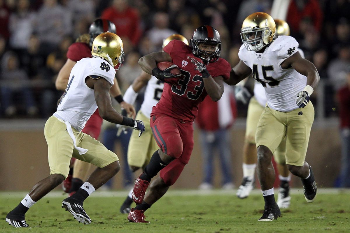 STANFORD, CA - NOVEMBER 26:  Stepfan Taylor #33 of the Stanford Cardinal runs the ball against the Notre Dame Fighting Irish at Stanford Stadium on November 26, 2011 in Stanford, California.  (Photo by Ezra Shaw/Getty Images)