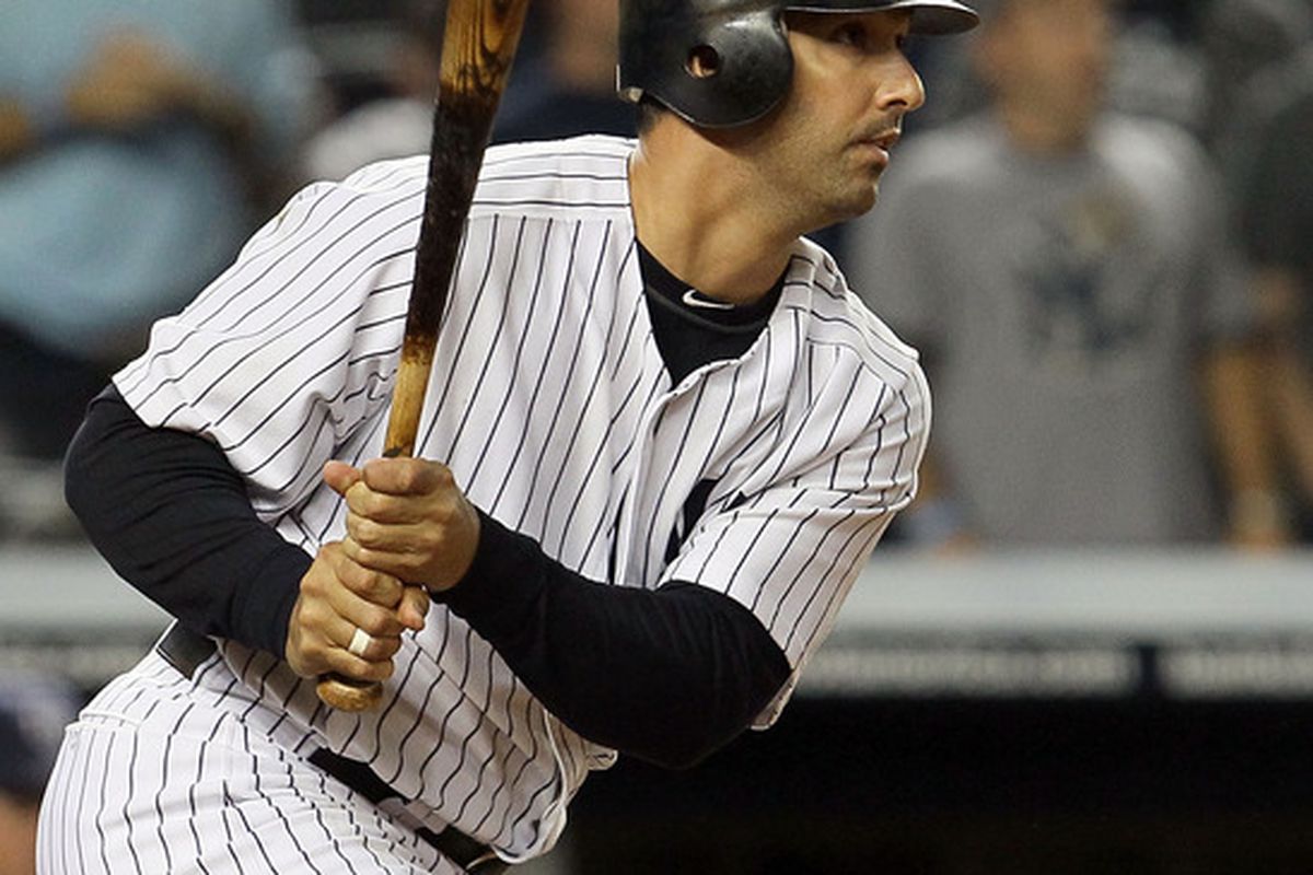 Jorge Posada of the New York Yankees hits a eighth inning two run single against the Tampa Bay Rays on September 21, 2011 at Yankee Stadium in the Bronx borough of New York City.  (Photo by Jim McIsaac/Getty Images)