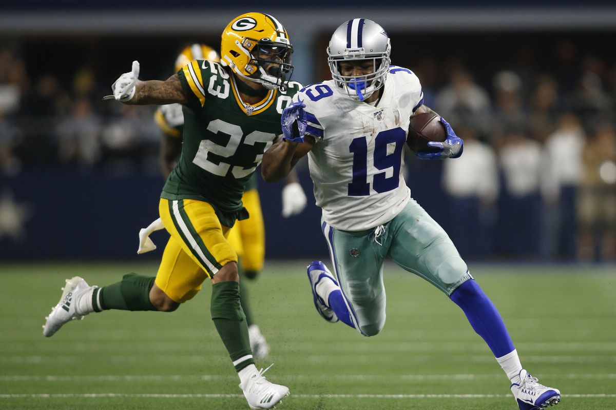 Dallas Cowboys wide receiver Amari Cooper catches a touchdown pass against Green Bay Packers cornerback Jaire Alexander in the fourth quarter at AT&amp;T Stadium.