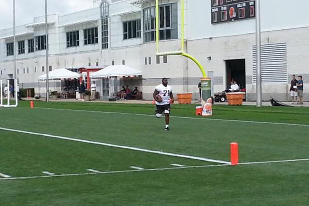 Ahtyba Rubin does sprints off in the end zone as he sits out of practice on the first day of camp open to the public. Photo credit: DBN member Doc's Kid