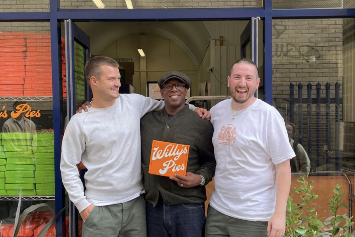 Will Lewis, Ian Wright, and Josh Hill of&nbsp;Willy’s Pies stand in front of the arch where Willy’s Pies makes pies
