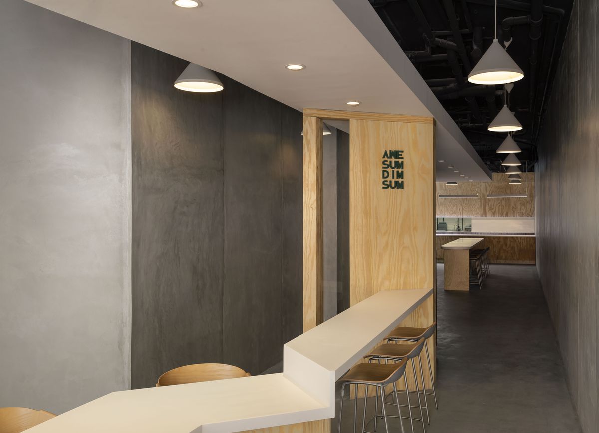 A fast-casual restaurant, AweSum DimSum, with a minimalist interior.,