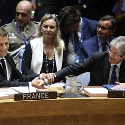 French President Emmanuel Macron, left, greets Italian Prime Minister Paolo Gentiloni as he arrives for a high level meeting of the United Nations Security Council on U.N. peacekeeping operations, Wednesday, Sept. 20, 2017, at U.N. headquarters.