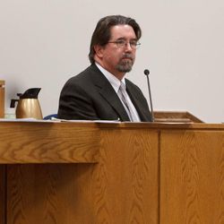 Utah Chief Medical Examiner Dr. Todd Grey testifies as the trial for Martin MacNeill continues in 4th District Court in Provo, Thursday, Oct. 31, 2013. MacNeill is accused of murder for allegedly killing his wife, Michele MacNeill, in 2007.