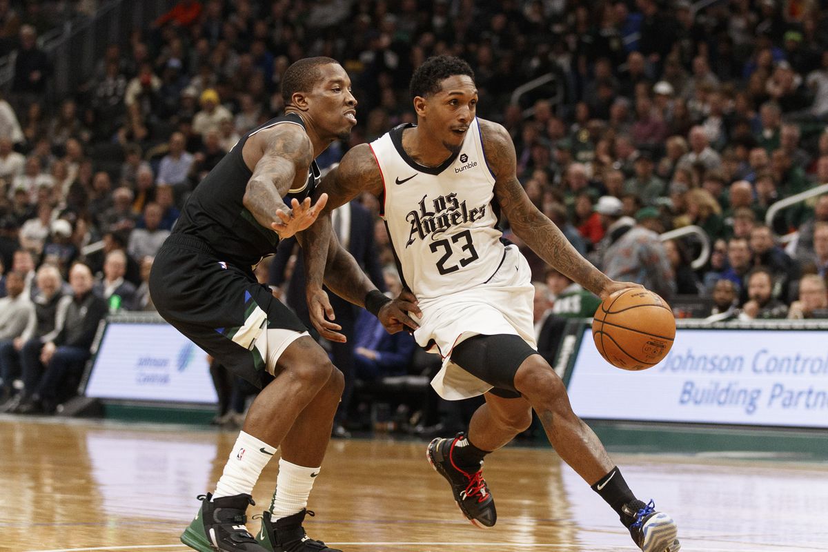Los Angeles Clippers guard Lou Williams drives for the basket against Milwaukee Bucks guard Eric Bledsoe during the third quarter at Fiserv Forum.&nbsp;