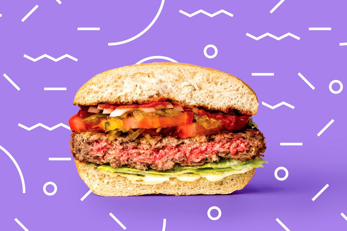 A cross section of an Impossible Burger against a jazzy purple background.