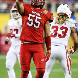 Utah Utes linebacker Kavika Luafatasaga (55) celebrates after bringing down Indiana Hoosiers running back Ricky Brookins (33) as the Utes and the Hoosiers play in the Foster Farms Bowl in Santa Clara, California on Wednesday, Dec. 28, 2016.